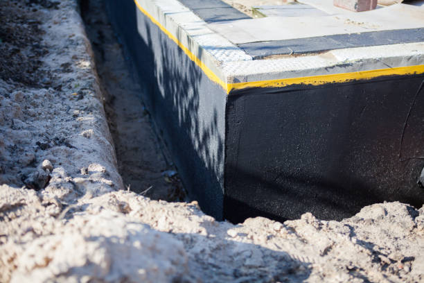 Professional Emergency Waterproofing technician working in Henryville, IN